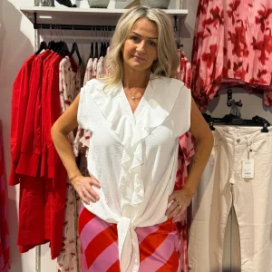 Topp med knyt och volang vit