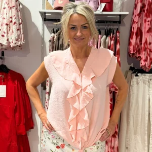 Topp med volang och knyt ljusrosa